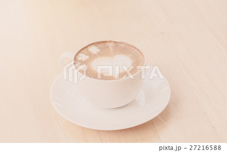 heart symbol on latte coffee cup on table heart symbol on latte coffee cup on table 27216588