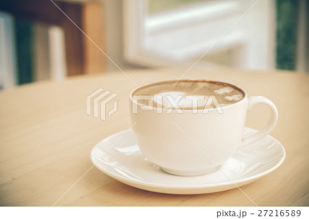 heart symbol on latte coffee cup on table heart symbol on latte coffee cup on table 27216589