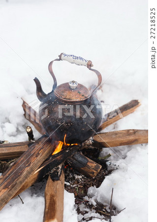 Copper kettle over an open fire in winter Copper kettle over an open fire in winter 27218525