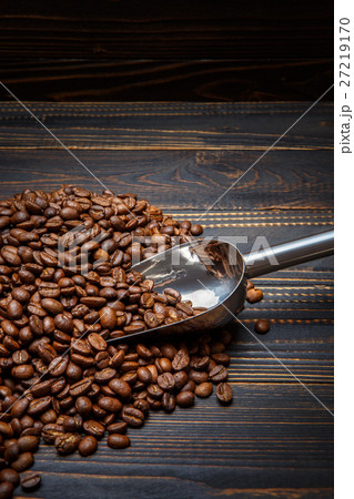 roasted coffee beans on wooden background roasted coffee beans on wooden background 27219170