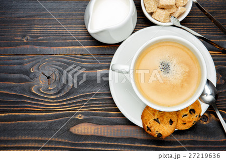 fresh cookies and coffee on wooden background fresh cookies and coffee on wooden background 27219636