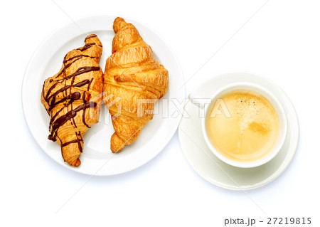 two fresh croissants and coffee on white two fresh croissants and coffee on white 27219815