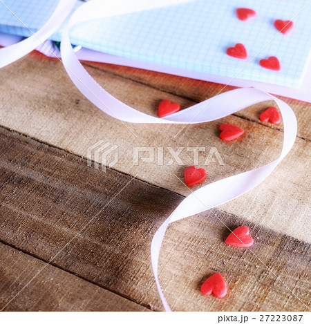 notepad and candy in the shape of heart notepad and candy in the shape of heart 27223087