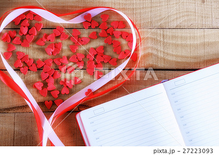 notepad and candy in the shape of heart 27223093