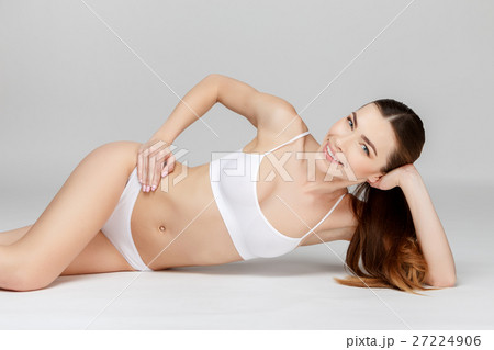 Perfect female legs on grey background 27224906