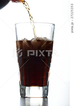 pouring brown soda into glass pouring brown soda into glass 27225353