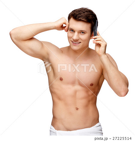 Handsome young man sniffing his armpit 27225514