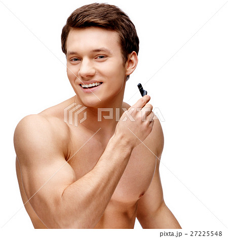 Handsome young man sniffing his armpit Handsome young man sniffing his armpit 27225548