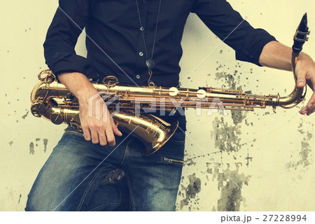 Saxophone Symphony Musician Jazz Instrument Concept Saxophone Symphony Musician Jazz Instrument Concept 27228994