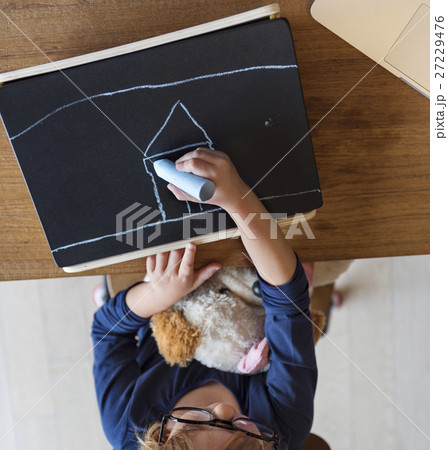 Little Girl Drawing Blackboard Concept 27229476