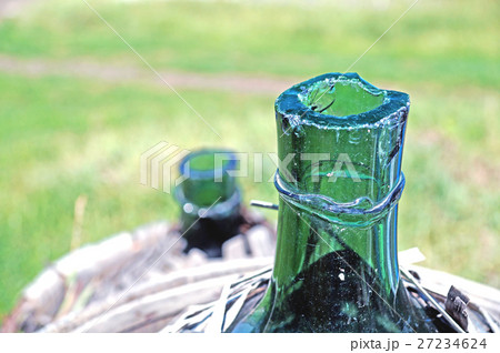 Old demijohn glass wrapped in wicker. 27234624