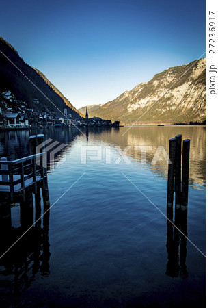 Hallstatt village reflected in lake in the Salzkam Hallstatt village reflected in lake in the Salzkam 27236917