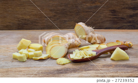 fresh ginger on wooden table fresh ginger on wooden table 27239352