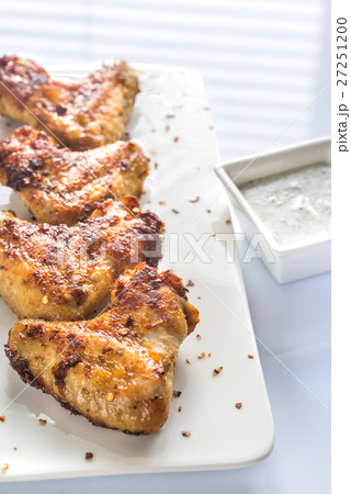 Fried chicken wings on the white plate 27251200