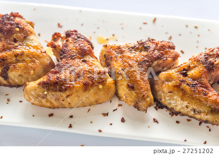 Fried chicken wings on the white plate 27251202
