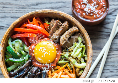 Bowl of bibimbap on the wooden table 27251528