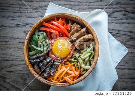 Bowl of bibimbap on the wooden table 27251529