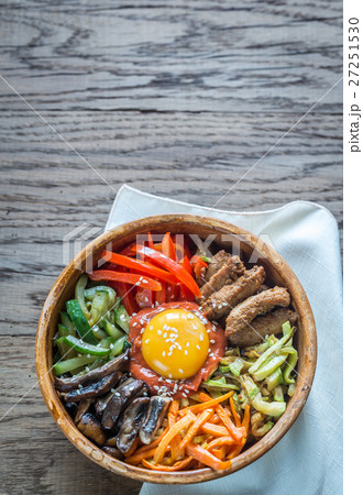 Bowl of bibimbap on the wooden table 27251530