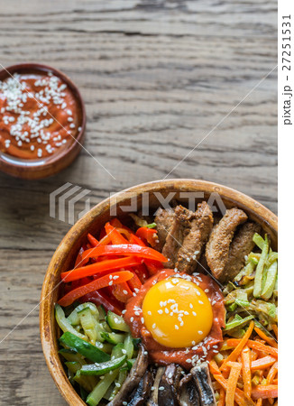Bowl of bibimbap on the wooden table 27251531