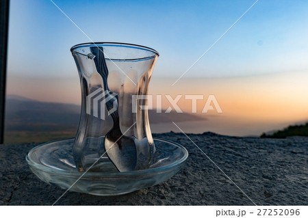 Empty turksih tea glass on a wonderful scenery Empty turksih tea glass on a wonderful scenery 27252096