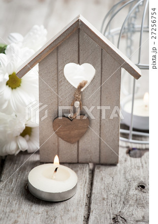 Easter background with candle, flowers, birdhouse Easter background with candle, flowers, birdhouse 27256754