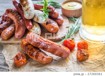 Grilled sausages with glass of beer Grilled sausages with glass of beer 27260361