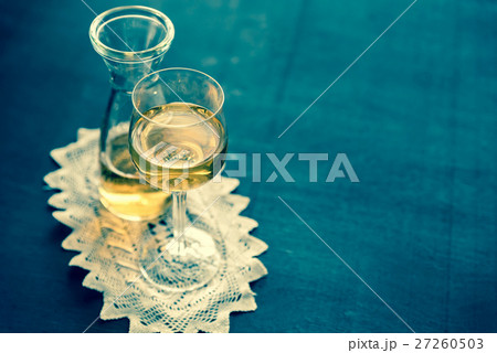 Glass of white wine in vintage decor 27260503