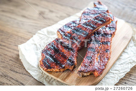 Grilled pork ribs on the baking paper Grilled pork ribs on the baking paper 27260726