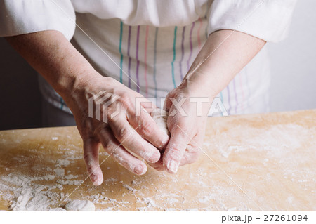 Two hands making meat dumplings. Two hands making meat dumplings. 27261094