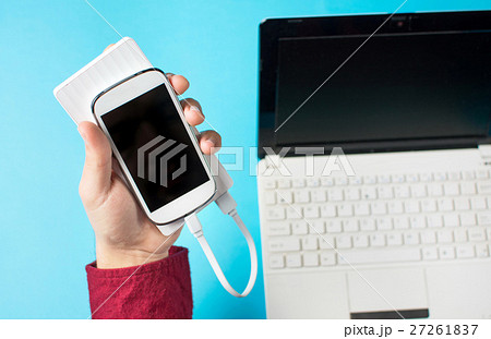 male hands holding a white cellphone 27261837