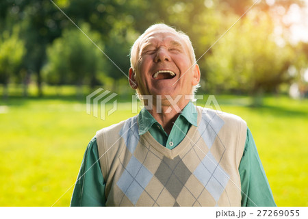 Elderly man laughing. Elderly man laughing. 27269055