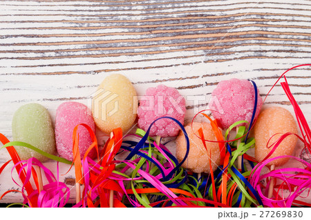 Candies on wooden background. 27269830