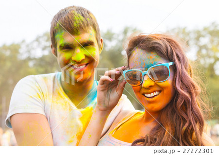 Portrait of happy couple on holi color festival Portrait of happy couple on holi color festival 27272301