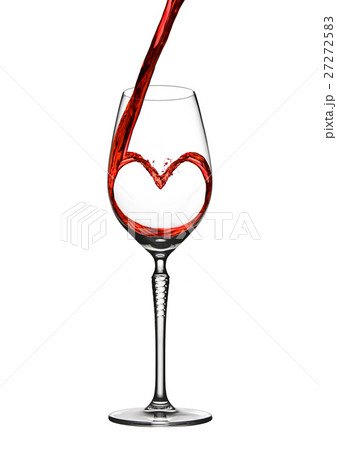 Pouring wine heart romantic shape to elegant glass 27272583