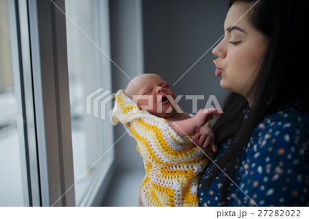 young mother with newborn baby 27282022