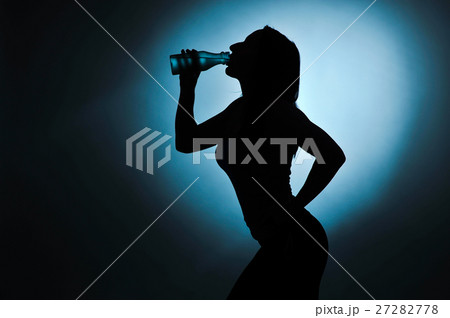 sport girl drinking water, silhouette studio shot sport girl drinking water, silhouette studio shot 27282778
