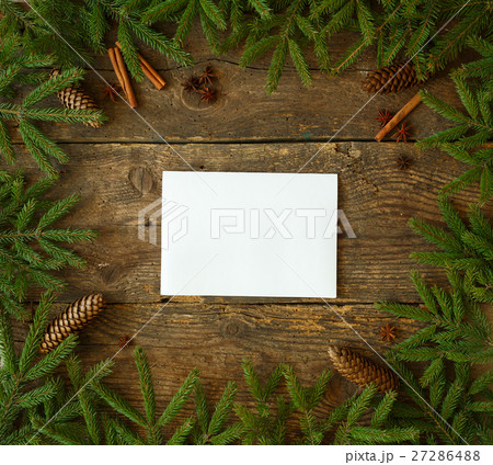 Christmas tree branch with cones, cinnamon sticks 27286488