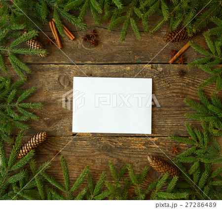 Christmas tree branch with cones, cinnamon sticks Christmas tree branch with cones, cinnamon sticks 27286489