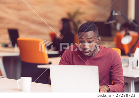 Young business man with a shocked expression 27288723
