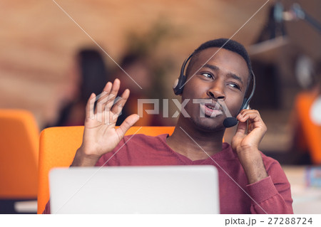 Customer Service agent in an startup office with Customer Service agent in an startup office with 27288724