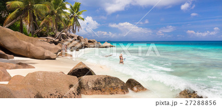 Woman enjoying Anse Patates picture perfect beach 27288856