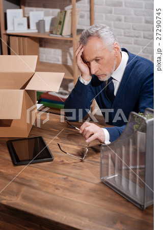 Worried office worker analyzing his career path 27290745
