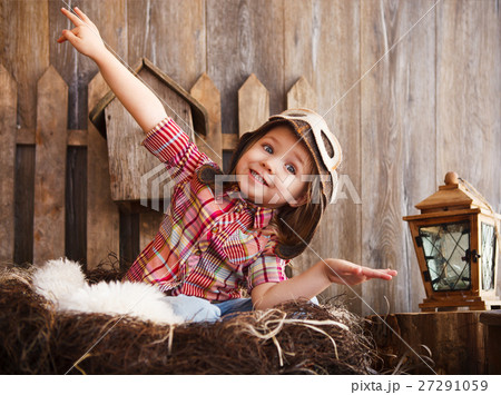 Happy kid playing in pilot helmet near Happy kid playing in pilot helmet near 27291059