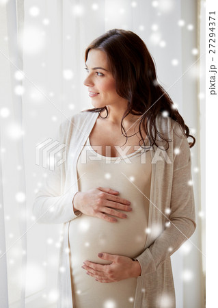happy pregnant woman with big tummy at home happy pregnant woman with big tummy at home 27294371