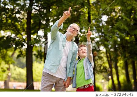 grandfather and boy pointing up at summer park grandfather and boy pointing up at summer park 27294645