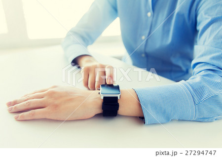 close up of hands setting smart watch 27294747