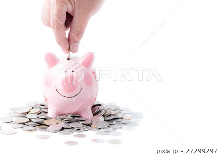 Businessman putting coin into pink piggy bank isolated 27299297