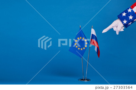 Two flags and hand on a blue background, Two flags and hand on a blue background, 27303564
