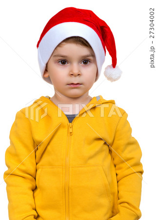 little boy wearing on red Santa helper hat 27304002