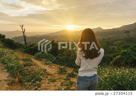 woman hiker taking photo at mountain 27304115